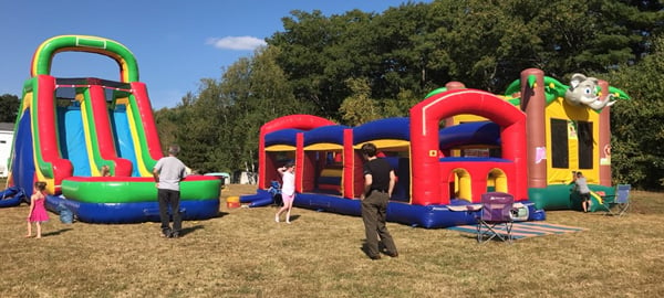 The mortgage-burning party included inflatable bouncy houses for children and adults, and a slide.