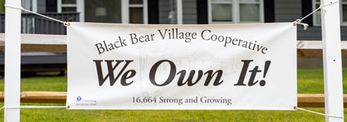 We Own it! sign at Black Bear Village Cooperative